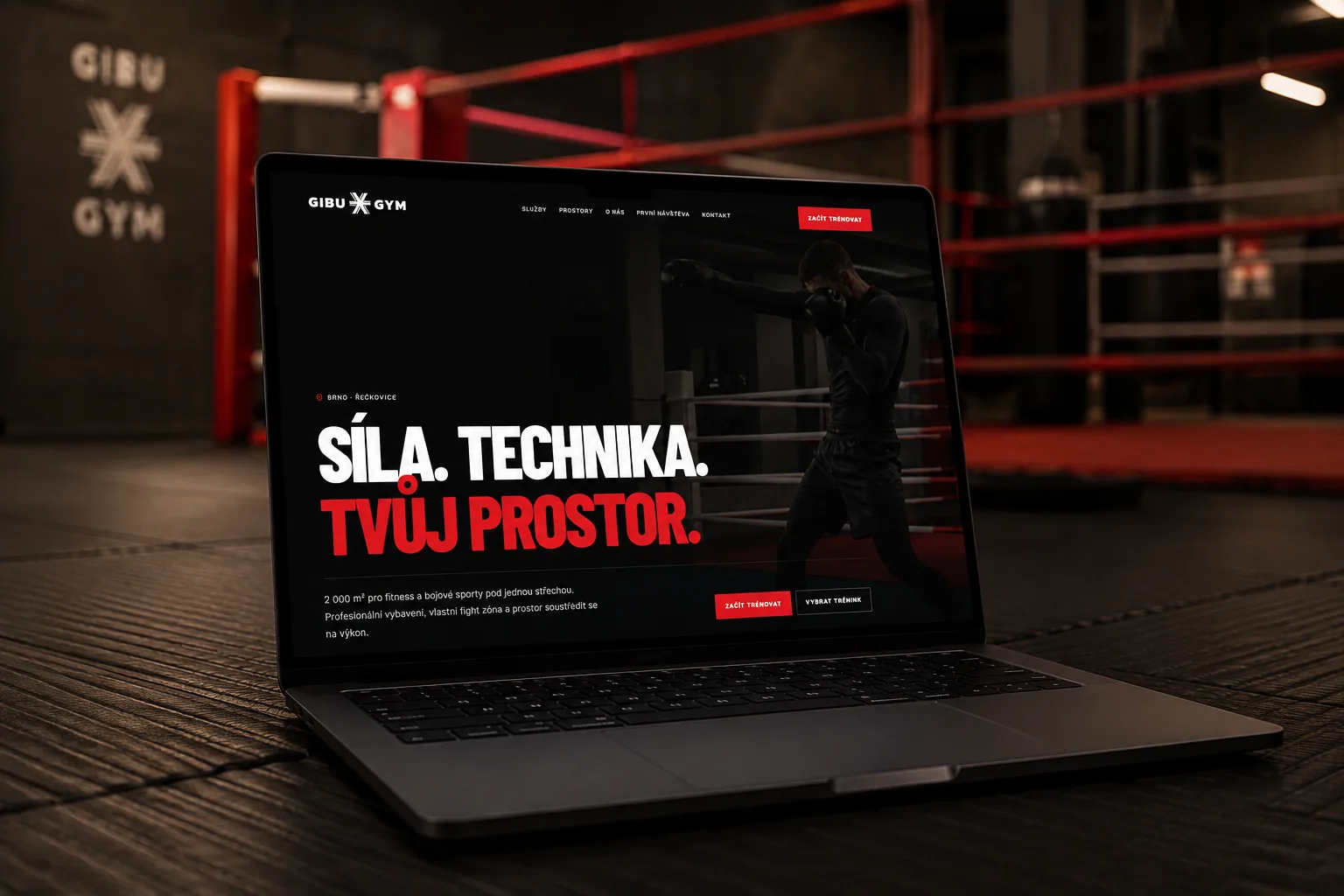 Gibu Gym website shown on a laptop inside the gym