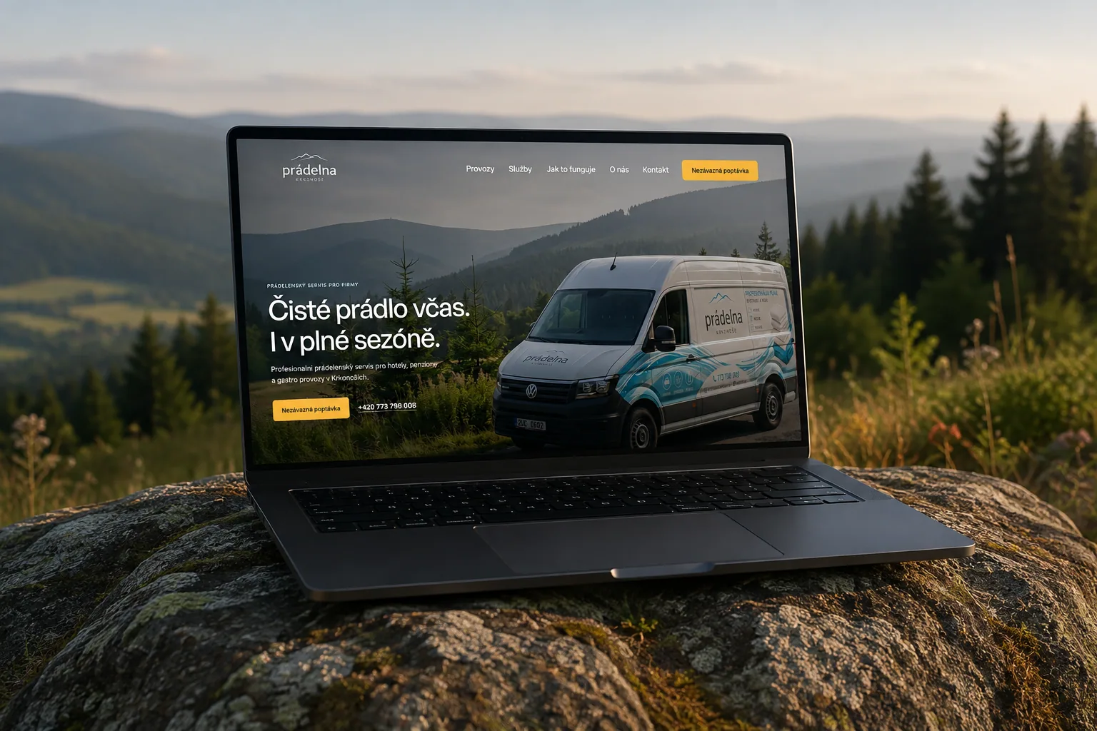 Prádelna website shown on a laptop in the Krkonoše landscape